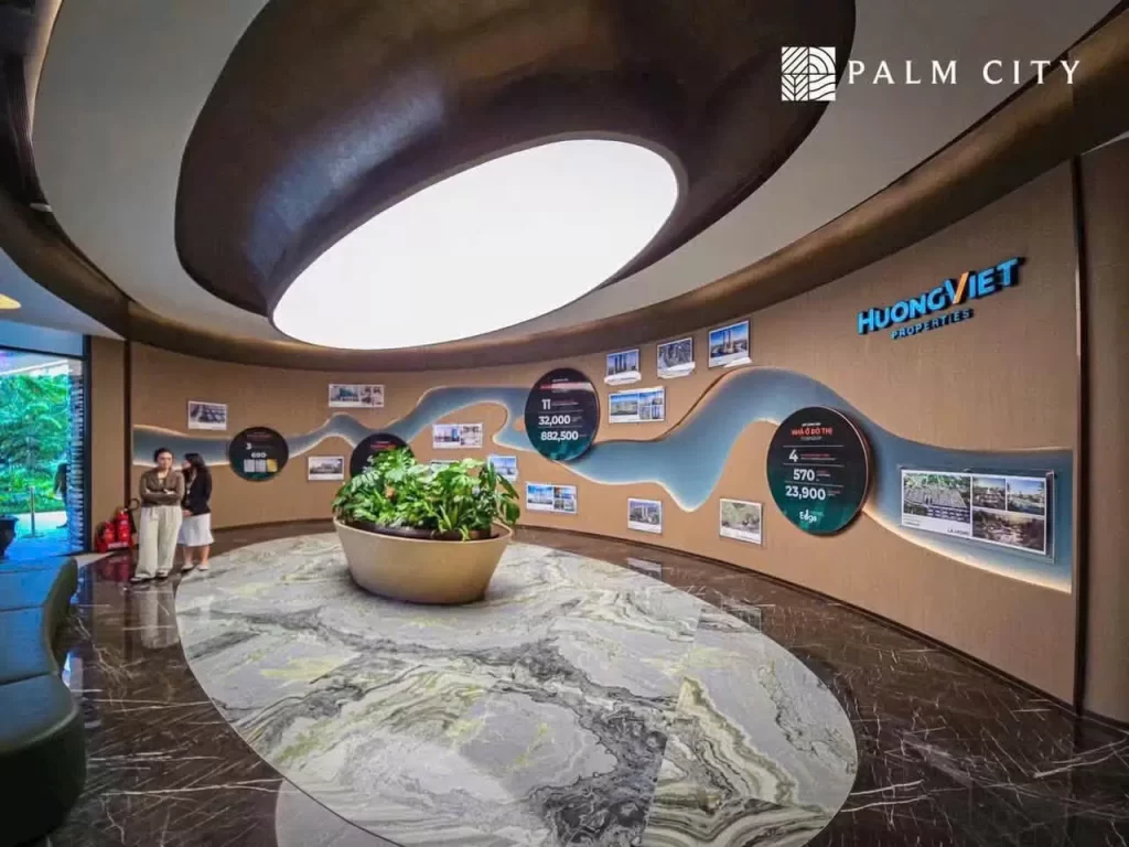 Tường giới thiệu Hướng Việt Properties trong nhà mẫu Palm River, họa tiết sông và các ô tròn