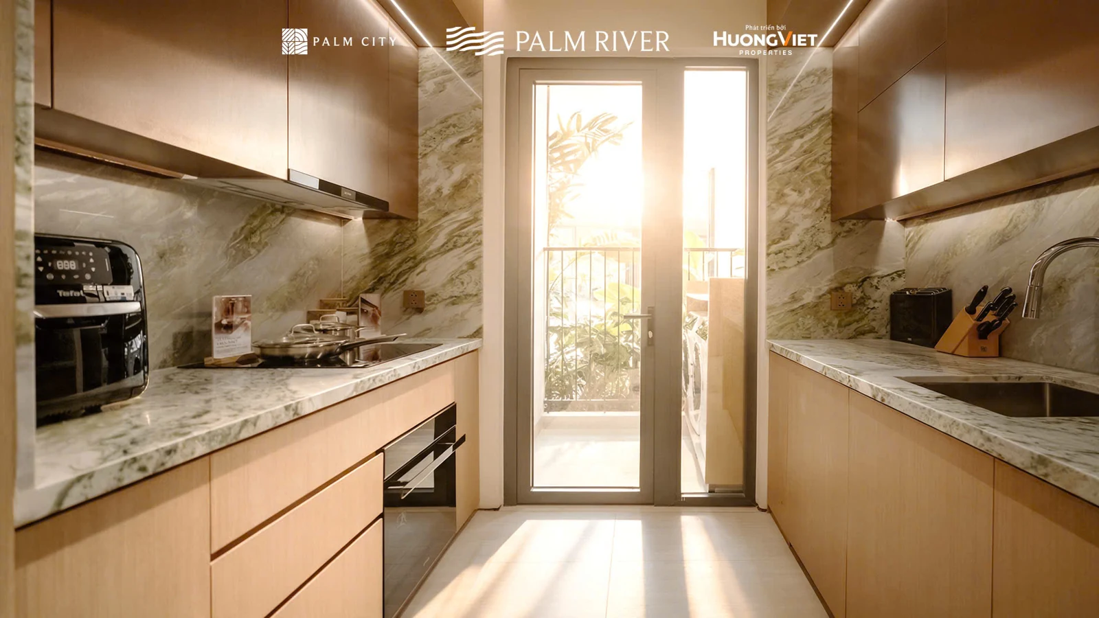 Nhà mẫu Palm River: hai dãy tủ bếp và mặt thao tác trong căn mẫu 2PN.