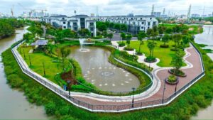 Toàn cảnh công viên hồ sinh thái ven sông với đài phun nước và đường dạo bộ dự án Gladia Heights